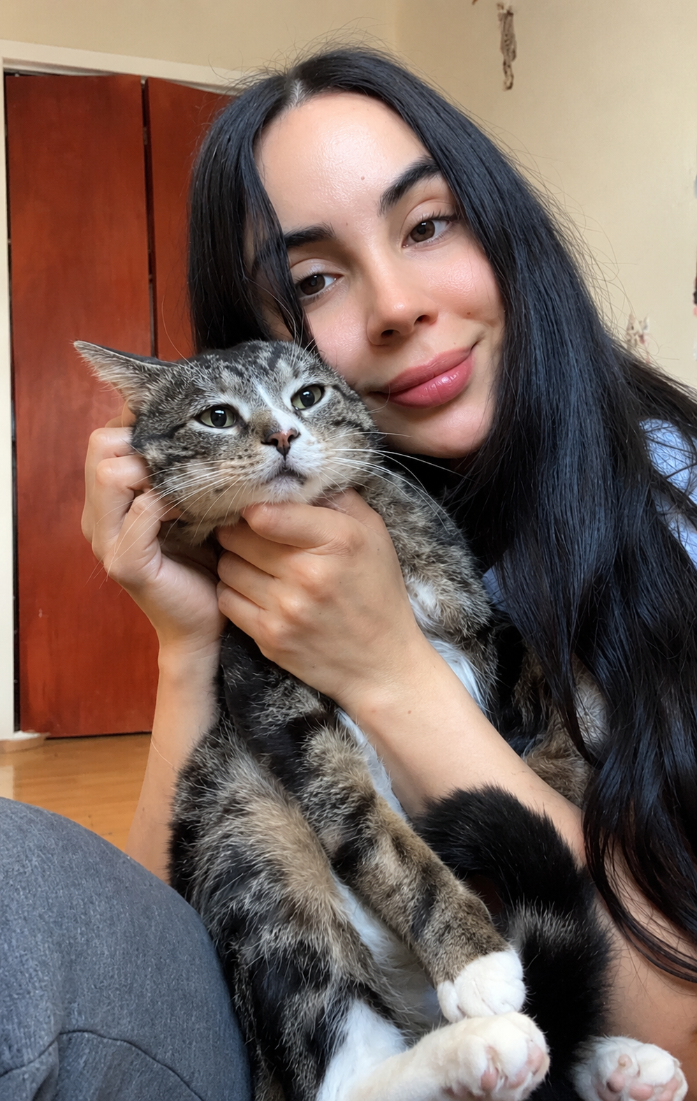 Vanessa holding a rescued cat in her arms